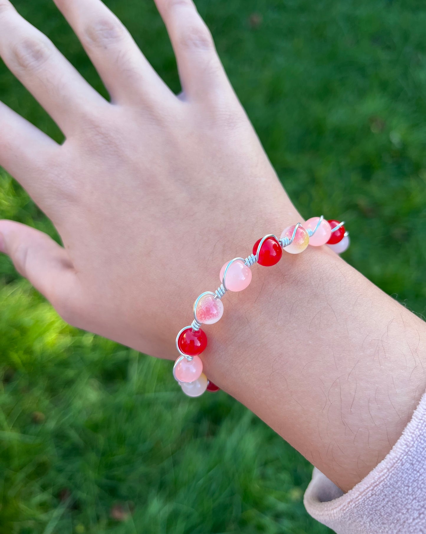 Red and peach wire wrapped bracelet