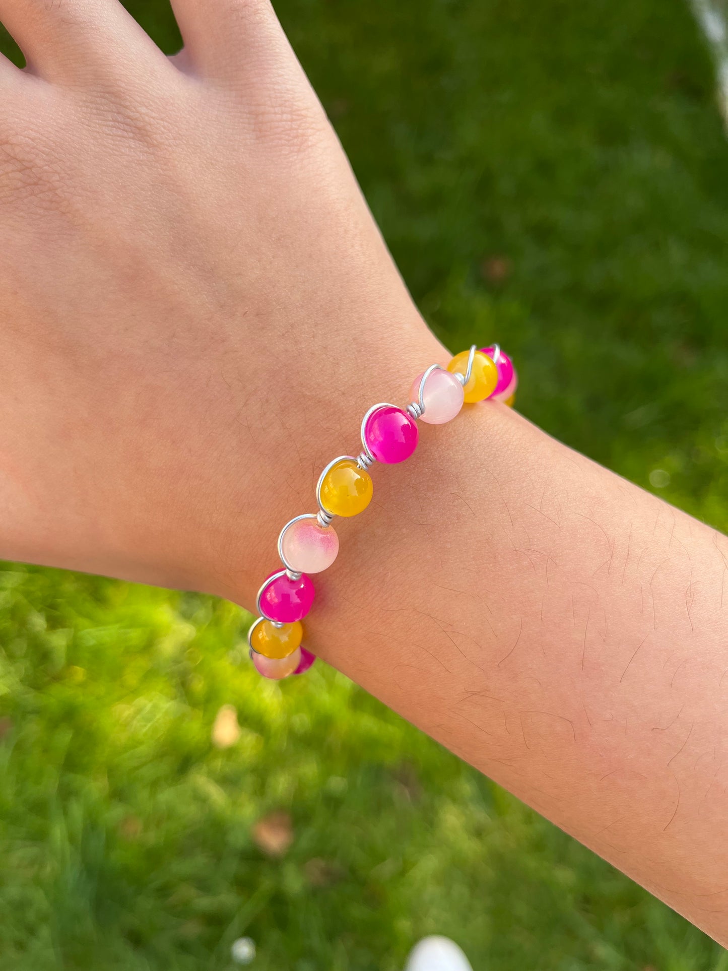 Pink and yellow wire wrapped bracelet