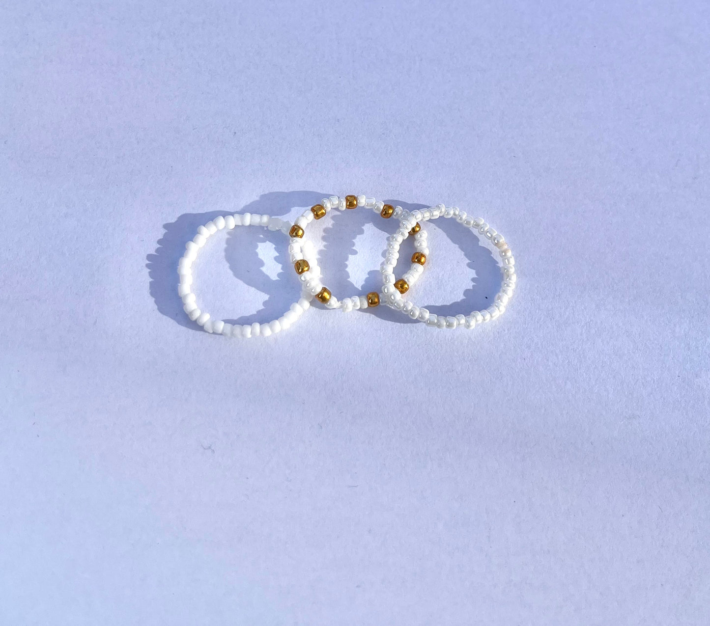 White and gold beaded ring set