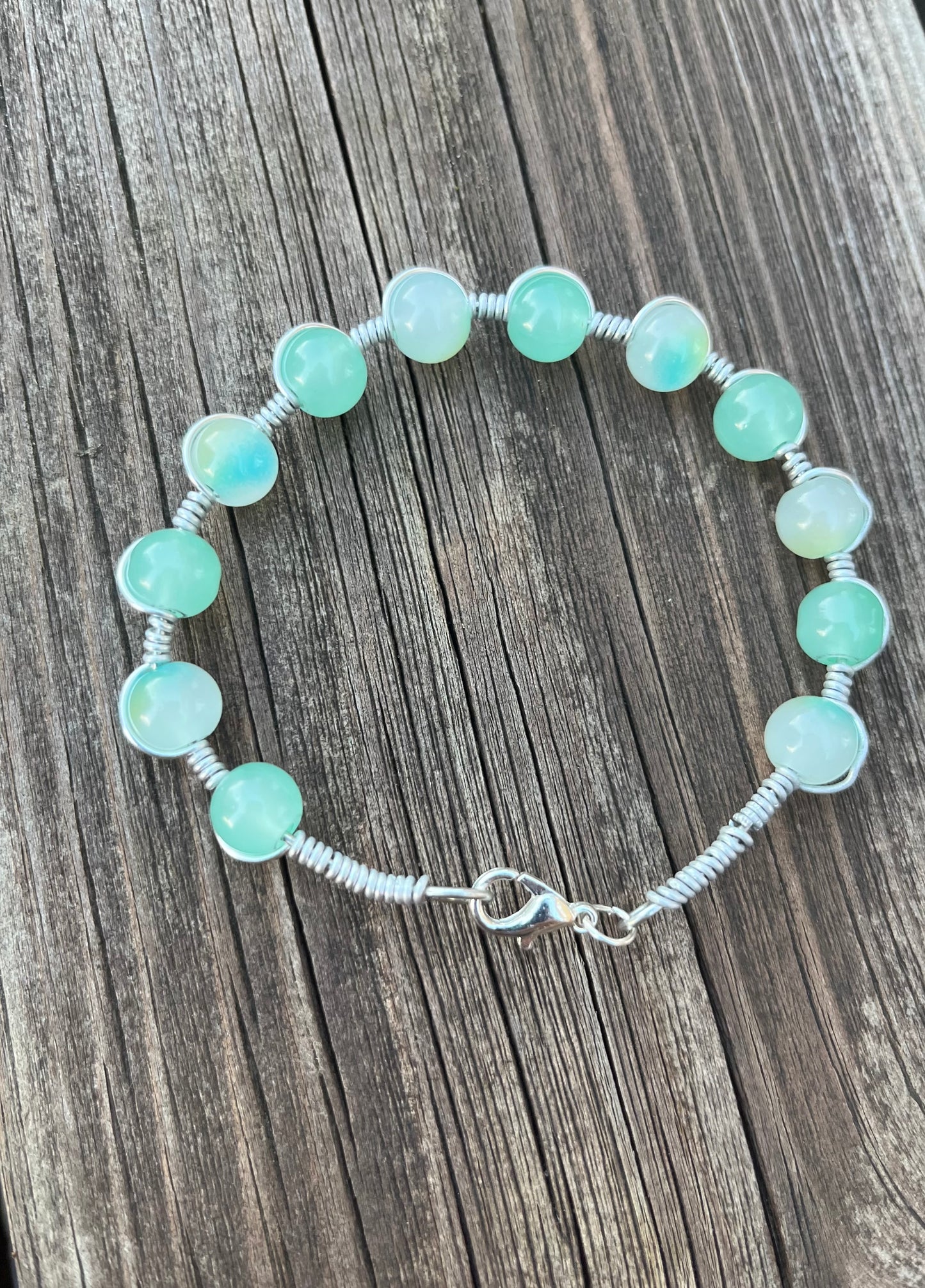 Light blue and teal wire wrapped bracelet