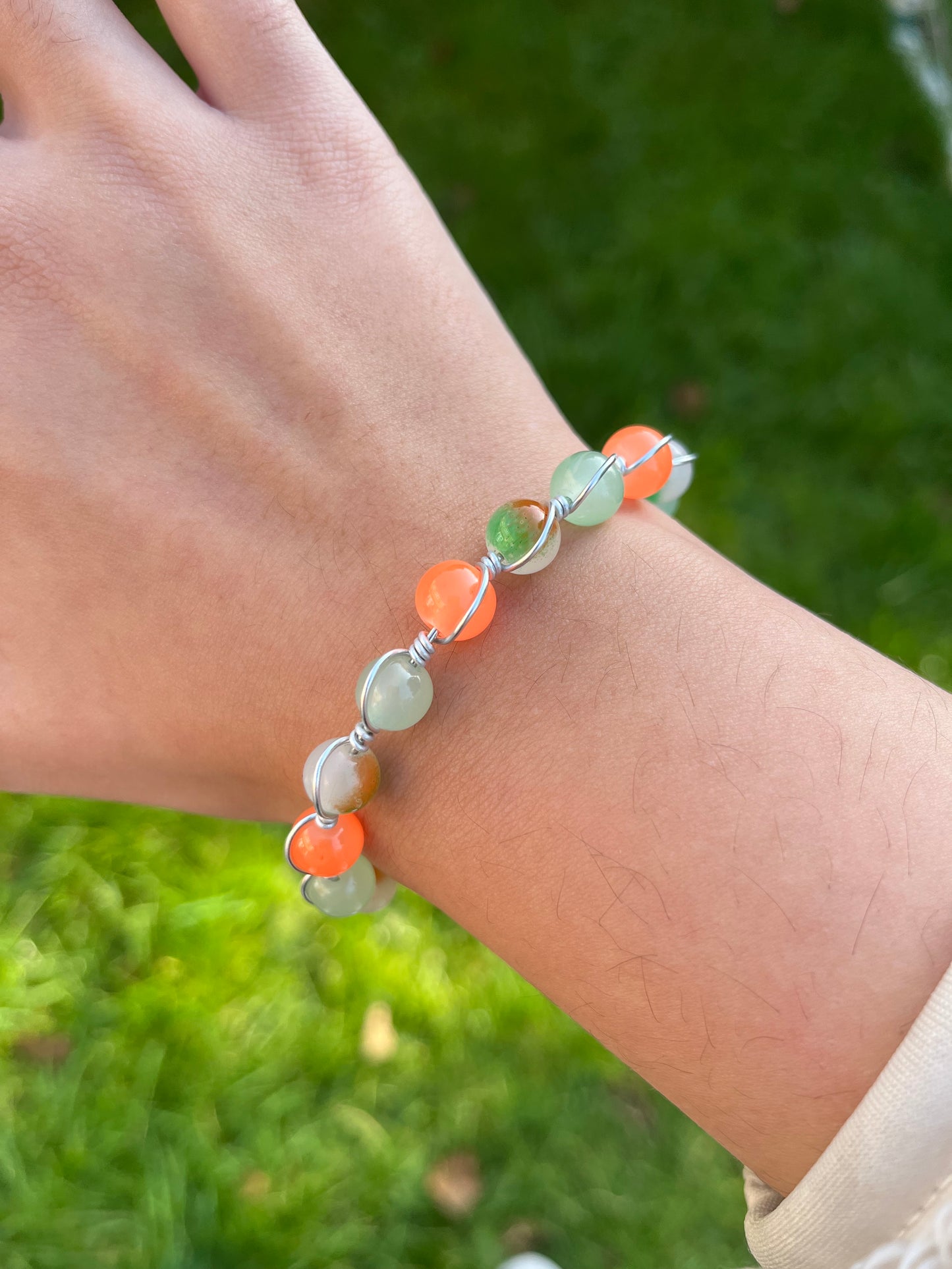 Orange and green wire wrapped bracelet