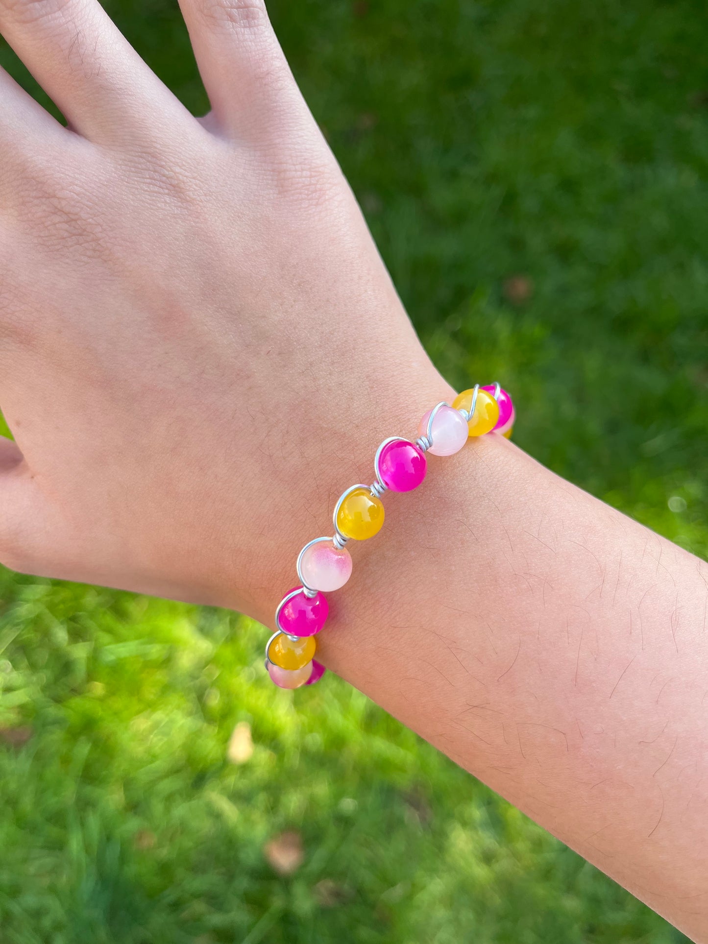 Pink and yellow wire wrapped bracelet