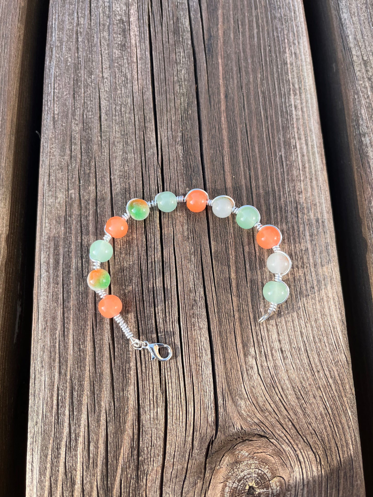 Orange and green wire wrapped bracelet