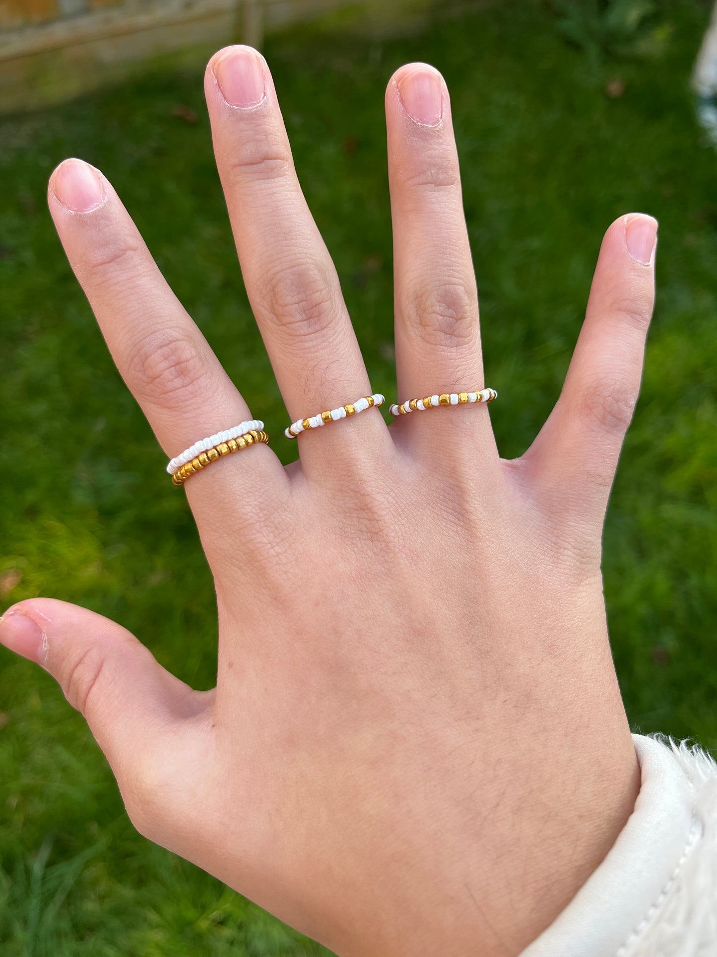 White and gold beaded ring set