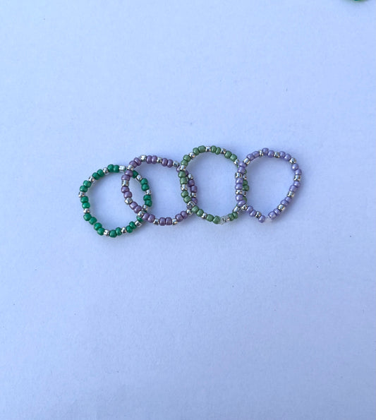 Purple and green beaded ring set